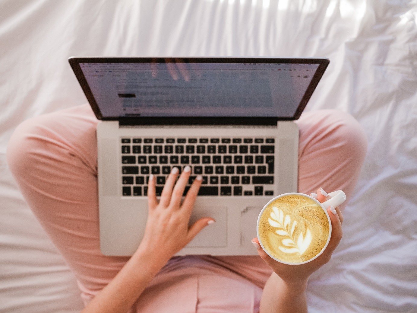 woman on laptop with latte