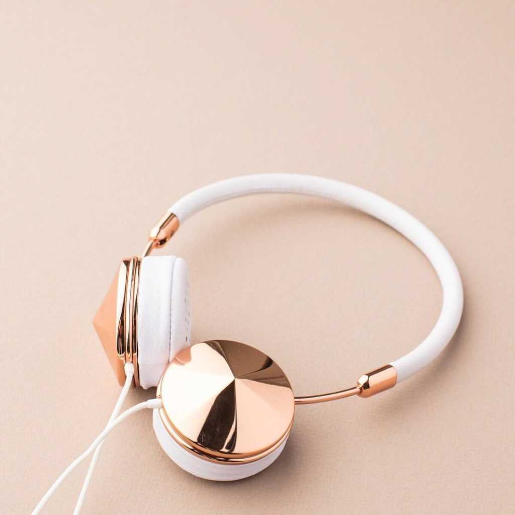 pair of headphones with rose gold detail