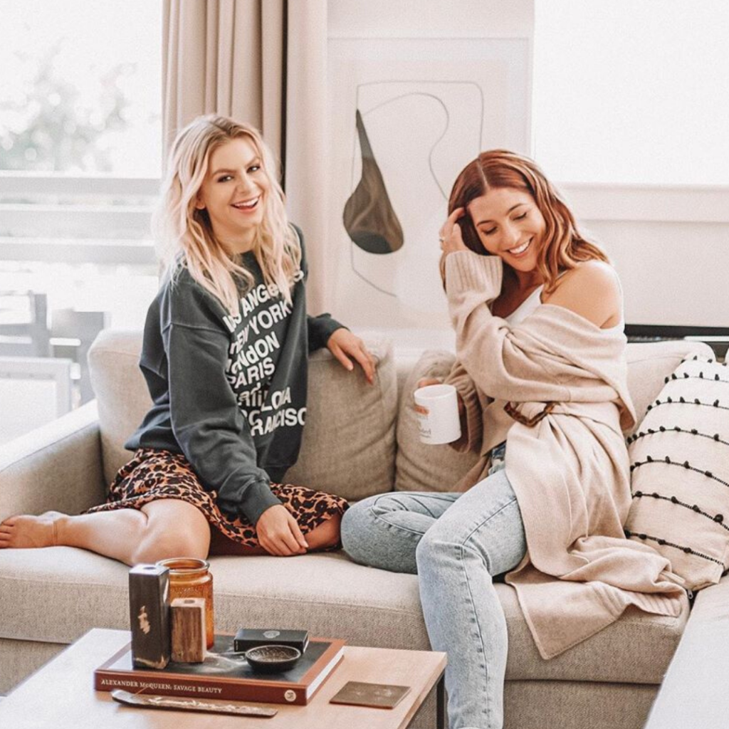 two women sitting on couch as an example of brand storytelling