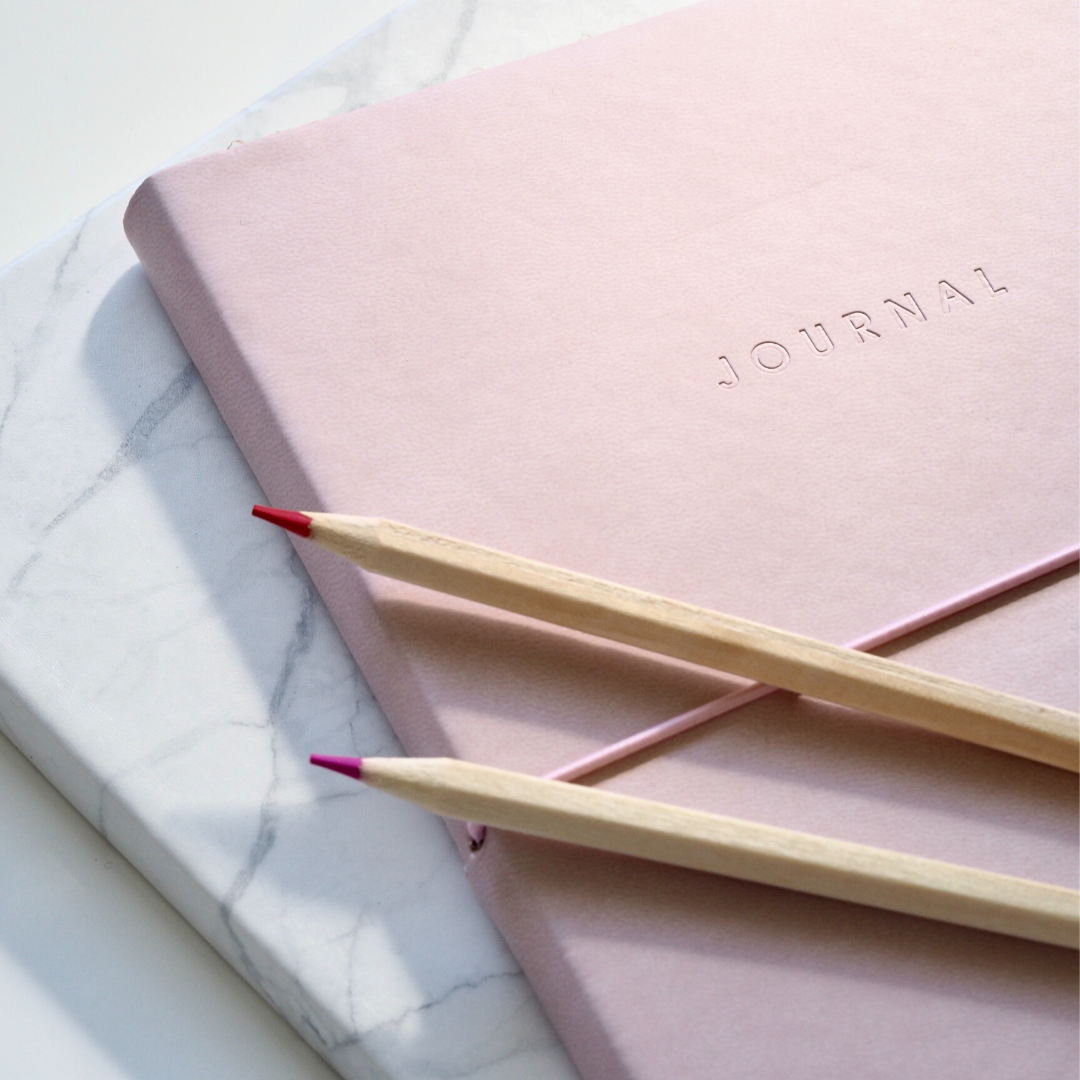pink journal to reduce stress