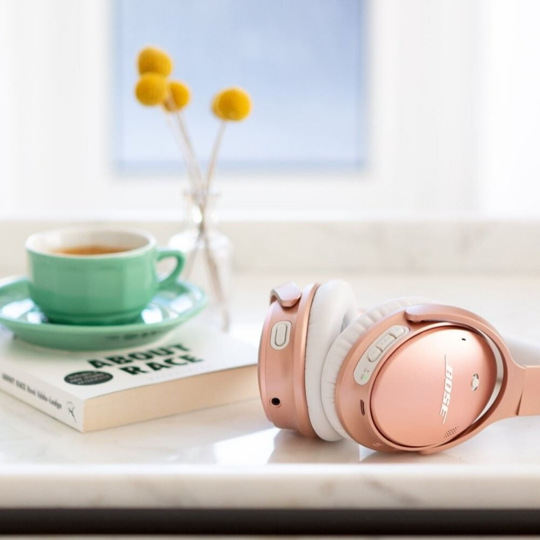 pink soundproof headphones on desk